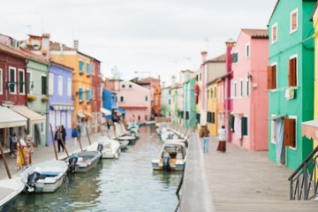 Colorful canals and charming houses in Burano, Venice during a quiet afternoon