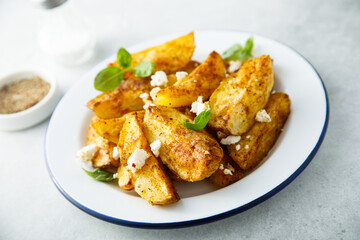 Roasted potato wedges with Feta cheese