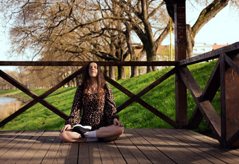 Young woman doing yoga in the park