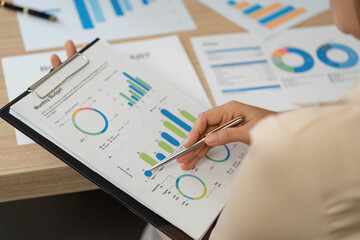 Plakat Budget Analysis. Professional reviewing monthly financial reports in a meeting.