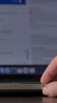white woman with glasses looking for a job on the internet, vertical video
