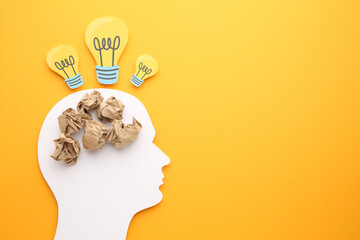 Creative thinking ideas and innovation concepts. Yellow coloured light bulb on the background