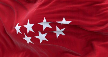 Detail of the Community of Madrid flag waving in the wind