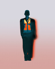 Silhouetted male in suit with bright orange glowing vest stands still in red gradient. Concept of...