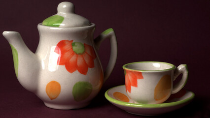 Indian masala chai or tea in cup, with kettle, spices and tea leaves on dark, wooden background. cafe, retro, restaurant, vintage, ethnic, healthy, hotel concepts.