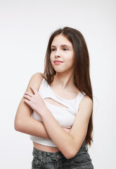 Fototapeta premium Portrait of a brunette in a white tank top.