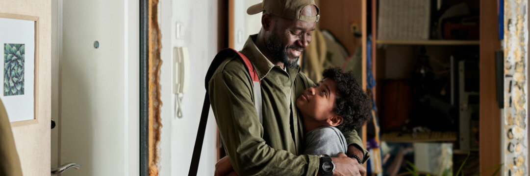 Happy Father and Child Hugging Before Going to Work Header