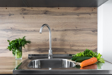 kitchen faucet on a stylish metal sink