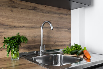 kitchen faucet on a stylish metal sink