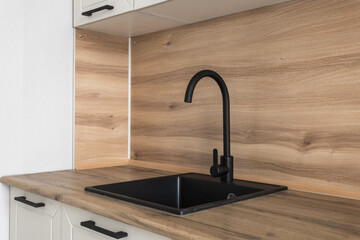 kitchen faucet on a stylish metal sink
