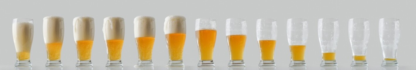 Collection of beer glasses in a row filled and consumed