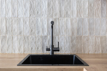 kitchen faucet on a stylish metal sink