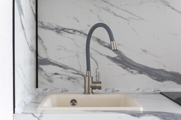 kitchen faucet on a stylish metal sink