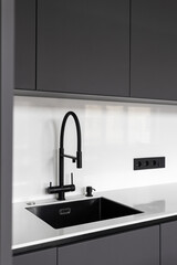 kitchen faucet on a stylish metal sink