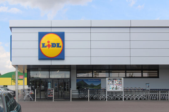 Large German grocery store chain Lidle exterior of famous discount grocery store Lidl with shopping trolleys outside