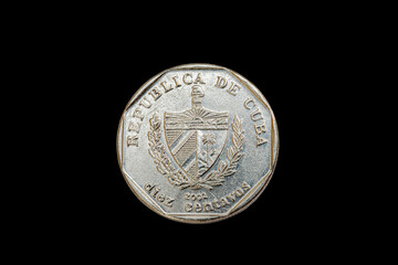 Obverse or heads side of a Nickel 2002 Cuban coin, shows a coat of arms,  name of the country and...