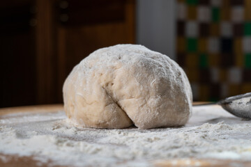 yeast dough on a wooden board. Fresh baked goods. Food. Bread. The concept of food