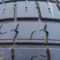 Weathered Tire Tread – Faded Rubber Surface with Dust and Cracks, Ultra Close-Up