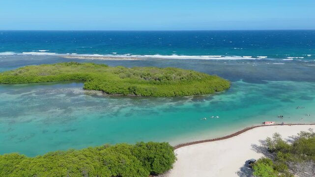 El Jobo Island From Playa Caobita In Summer In Azua, Dominican Republic. - aerial shot