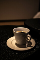 cup of coffee on black background