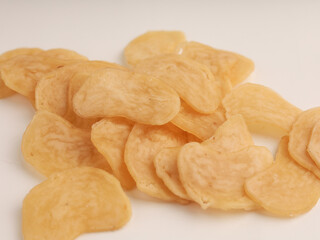 Heap of raw crackers on white background