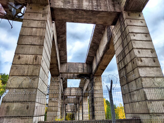 View of structural supports of Krasnoyarsk Hydroelectric Power Station under cloudy sky