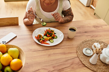 Enjoying a colorful salad at home while embracing healthy eating habits
