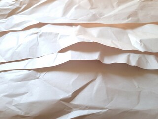 Sheets of crumpled paper. Close-up of sheets of crumpled light paper. Paper background