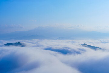 The beautiful natural landscape is a sea of mist in the morning, the movement of the fog covering the Mountain—tourism to enjoy the natural beauty of Mae Chaem, Chiang Mai, Northern Thailand.