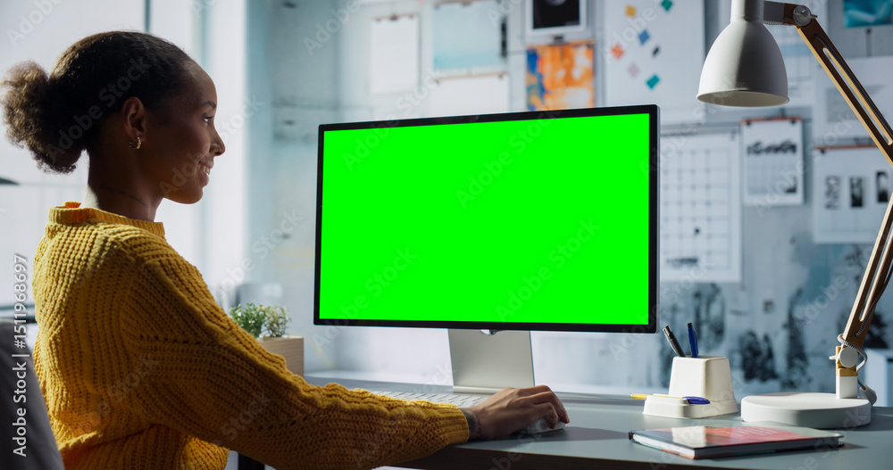Poster black female engineer uses desktop computer with green screen chroma key. modern office setup with c