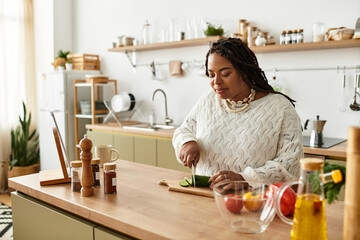 Young woman prepares a fresh and colorful salad in her cozy kitchen at home