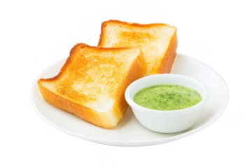 Two slices of golden brown toasted bread served with a small bowl of vibrant green sauce on a white plate. 
