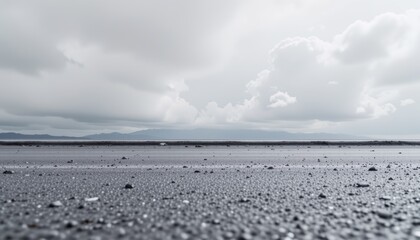 Obraz premium Calm Ocean Surface Under Overcast Sky with Dramatic Clouds at the Horizon