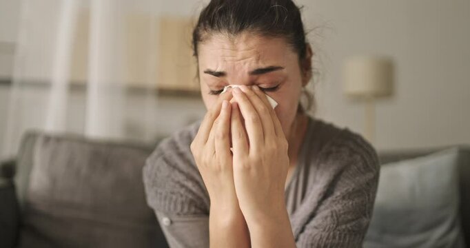 Sad young woman dealing with loss and psychological trauma