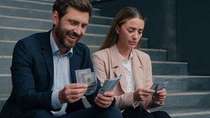 Caucasian colleagues man woman count money salary business financial inequality envy offended female girl worker with laughing happy male manager rivalry jealousy cash bills discrimination in city