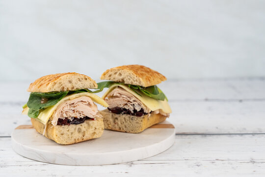 Turkey, swiss cheese and cranberry sauce sandwich on a ciabatta bread   