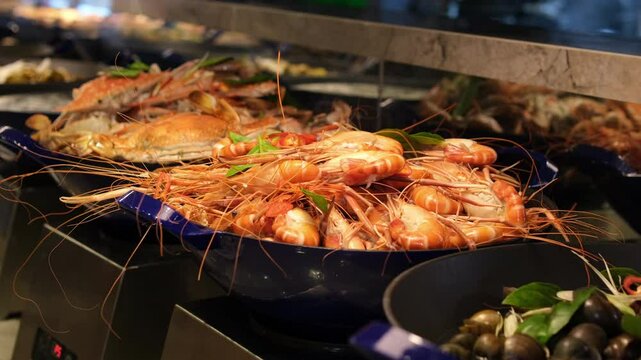 overhead view of hot and spicy chinese sichuan seafood and vegetables mixed buffet food in restaurant. High quality 4k footage