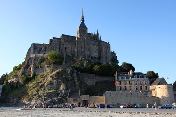 view of famous Le Mont Saint-Michel tidal island in beautiful twilight during blue hour at dusk, Normandy, France