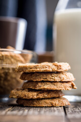 Sweet oatmeal cookies on wooden table.