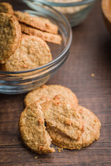 Sweet oatmeal cookies on wooden table.