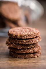 Sweet oatmeal cookies on wooden table.