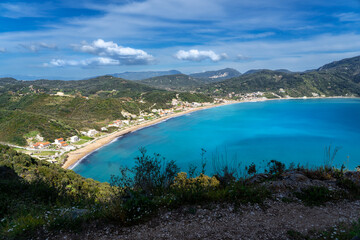 Fototapeta premium Discover the breathtaking beauty of Agios Georgios in Corfu, Greece—a stunning coastal village with turquoise waters, scenic landscapes, and the perfect summer escape.