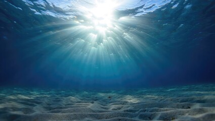 Underwater sunlight beams ocean floor sand