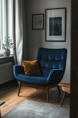 Plakat Dark blue chair in stylish modern living room. Cozy living room arrangement with sitting area, colorful pillows and picture frames.