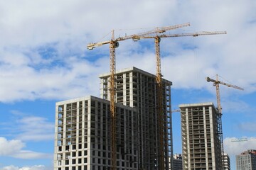 Fototapeta premium building under construction, construction site with cranes