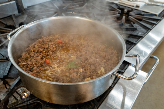 Cuban Picadillo dish being cooked on a gas stove 