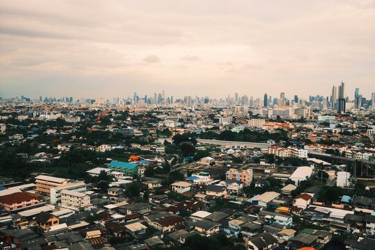 Aerial night cityscape panorama of Bangkok with urban architecture and illuminated downtown skyline 