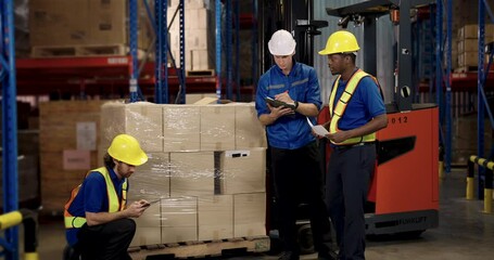 Multiracial supervisor leads diverse subordinate team planning work strategy inside spacious warehouse using tablet and printed plan during dynamic clip motion with african, asian, caucasian - Powered by Adobe