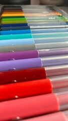 Colorful arrangement of art markers in various shades displayed on a flat surface highlighting creativity and artistic expression