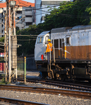 Train and railway worker in Jakarta, Indonesia.